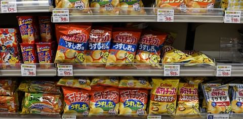 Bags of Calbee chips at a supermarket in Tokyo in July 2021.