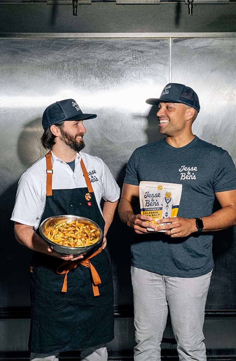 Jesse Konig (left) and Ben Johnson, co-founders of Jesse & Ben's, celebrate the brand's $10 million Series A funding to accelerate retail expansion and supply chain growth. Jesse Konig (left) and Ben Johnson, co-founders of Jesse & Ben's, celebrate the brand's $10 million Series A funding to accelerate retail expansion and supply chain growth.