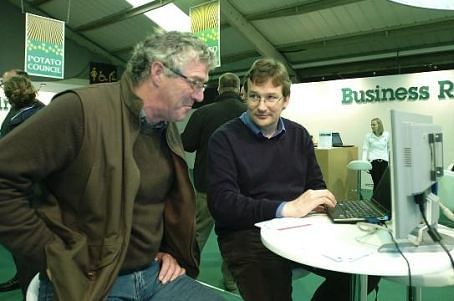 Dr Jon Hillier demonstrates the Cool Farm Tool to a farmer