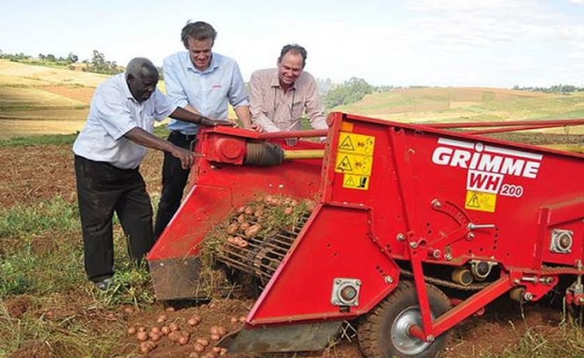 George Kinuthia (left) checks the progress of the potato harvesting at his farm in Molo with Fergus Robley (right) the Managing Director of FMD East Africa and Jan Soltau (centre) the Sales Manager of Grimme.
