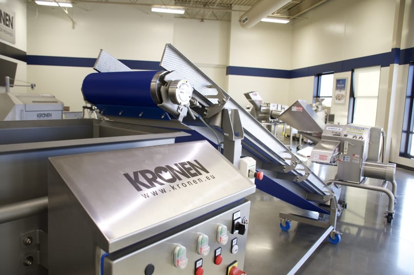  KRONEN food processing equipment, including conveyors and processing lines, now offered through Urschel’s global sales and support network.