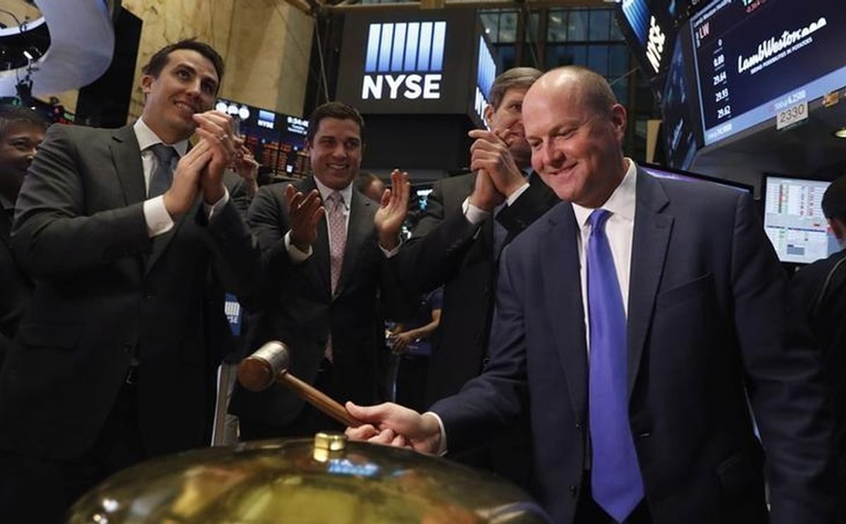 Lamb Weston President and CEO Tom Werner ringsa ceremonial bell after taking part in the company's IPO on the floor of the New York Stock Exchange (NYSE) in New York City, NY, U.S. November 15, 2016 (Courtesy: Reuters / Yahoo Finance)
