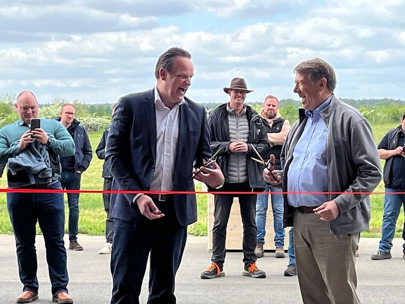 Lars Willem Köpp, CEO of TASC International GmbH, and John Forsythe of the One Four Group share a light moment before cutting the ribbon to officially open the new Trial and Research Center in Rosche, Germany. Lars Willem Köpp, CEO of TASC International GmbH, and John Forsythe of the One Four Group share a light moment before cutting the ribbon to officially open the new Trial and Research Center in Rosche, Germany.