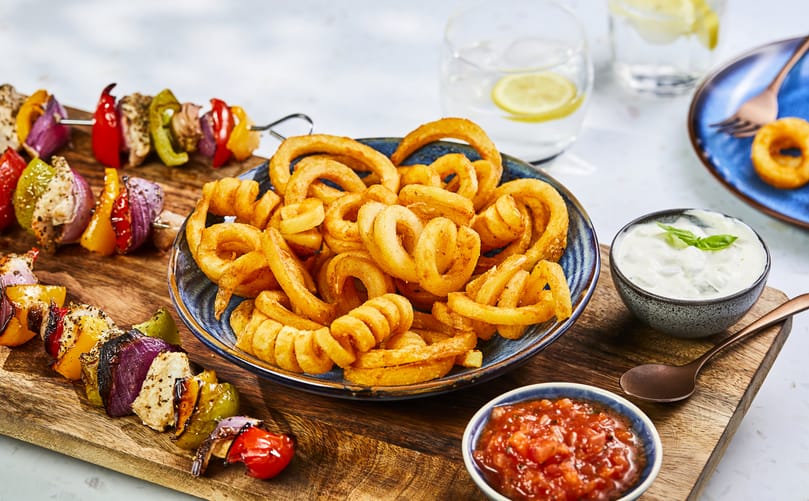 Lamb Weston Twister Fries (Seasoned), the original curly fry, featured with grilled kebabs as part of the award-winning retail range Lamb Weston Twister Fries (Seasoned), the original curly fry, featured with grilled kebabs as part of the award-winning retail range