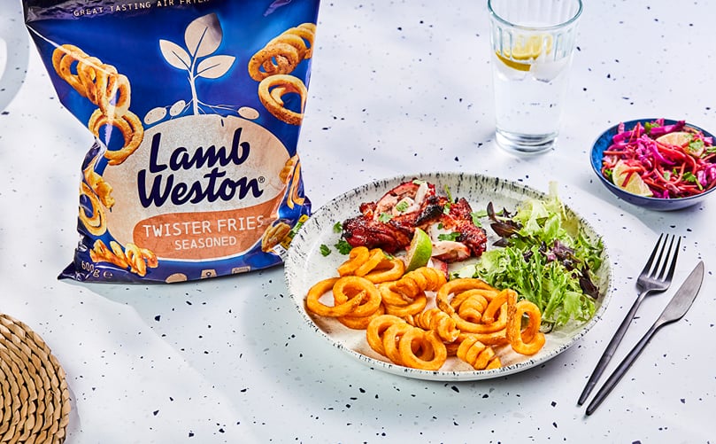 Lamb Weston Twister Fries (Seasoned) served with Asian-style chicken, demonstrating the versatility of the Product of the Year 2026 Fries range Lamb Weston Twister Fries (Seasoned) served with Asian-style chicken, demonstrating the versatility of the Product of the Year 2026 Fries range