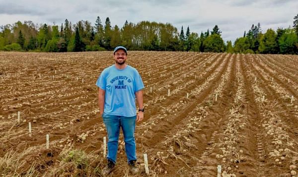 PRESQUE ISLE, Maine -- January 4, 2023 -- Mario Andrade, assistant professor of potato breeding and genetics at the University of Maine in Orono, stands in a potato field at the Aroostook Farm in Presque Isle during the September 2022 harvest. Andrade too