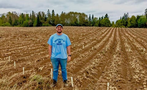 Mario Andrade, assistant professor of potato breeding and genetics at the University of Maine in Orono, stands in a potato field at the Aroostook Farm in Presque Isle during the September 2022 harvest. Andrade too Mario Andrade, assistant professor of potato breeding and genetics at the University of Maine in Orono, stands in a potato field at the Aroostook Farm in Presque Isle during the September 2022 harvest. Andrade too