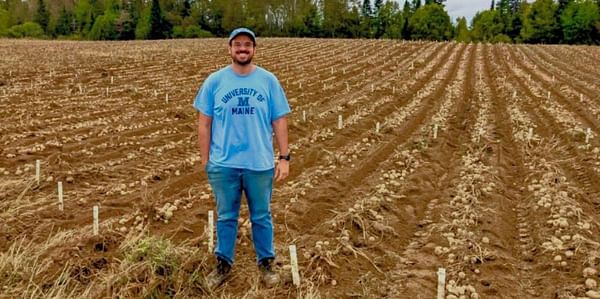 PRESQUE ISLE, Maine -- January 4, 2023 -- Mario Andrade, assistant professor of potato breeding and genetics at the University of Maine in Orono, stands in a potato field at the Aroostook Farm in Presque Isle during the September 2022 harvest. Andrade too