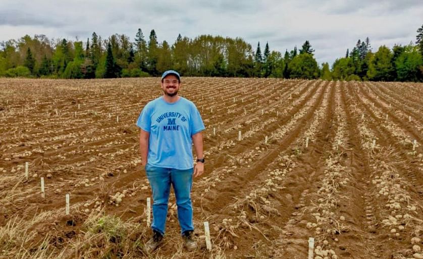 Mario Andrade, assistant professor of potato breeding and genetics at the University of Maine in Orono, stands in a potato field at the Aroostook Farm in Presque Isle during the September 2022 harvest. Andrade too