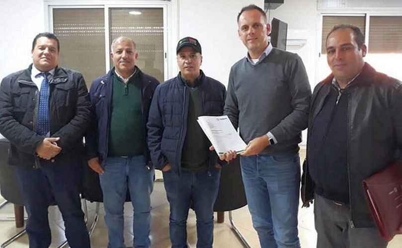 Signing a contract in El Hajeb, Morocco.