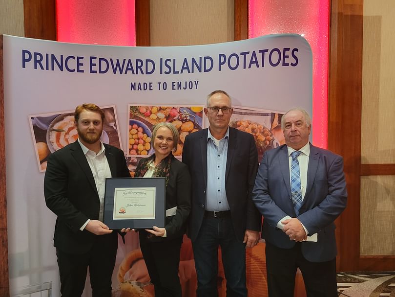 Mary Robinson, Adam Wight receiving the industry recognition award on behalf of John Robinson from John Visser and Vernon Campbell.