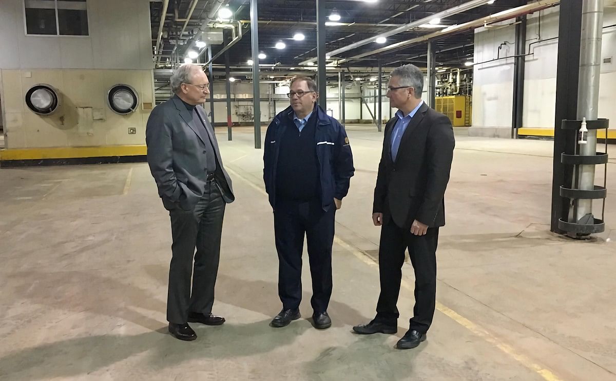Premier Wade MacLauchlan joins Ron MacDougall, President and CEO of MacDougall Steel Erectors (centre), and Heath MacDonald, Minister of Economic Development and Tourism at an announcement today marking MacDougall Steel's purchase of the former McCain Fac