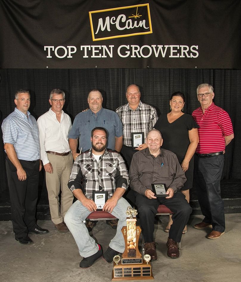 Super Farms Potato Ltd. of Saint-André was named the 2015-2016 McCain Champion Potato Grower for Grand Falls.
Front Row, L-R: André Levesque, Jean-Guy Levesque.
Back Row, L-R: Luc Coté, Field Department Manager, Allison McCain, Chairman, McCain Foods Limited, Luc Levesque, Jules Levesque, Christine Wentworth, VP Agriculture NA, Dale McCarthy, VP Integrated Supply Chain NA. Super Farms Potato Ltd. of Saint-André was named the 2015-2016 McCain Champion Potato Grower for Grand Falls.
Front Row, L-R: André Levesque, Jean-Guy Levesque.
Back Row, L-R: Luc Coté, Field Department Manager, Allison McCain, Chairman, McCain Foods Limited, Luc Levesque, Jules Levesque, Christine Wentworth, VP Agriculture NA, Dale McCarthy, VP Integrated Supply Chain NA.