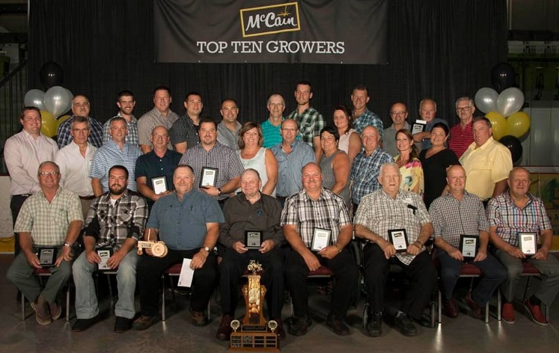 Front Row, L-R : Gildor Roberge, André Levesque, Luc Levesque, Jean-Guy Levesque, Jules Levesque, Lionel Poitras, André Levesque, Mario Levesque.
Middle Row, L-R : Andrew Jay, Grand Falls Plant Manager, Allison McCain, Chairman, McCain Foods Limited, Luc Coté, Field Department Manager, Paul Levesque, Marc Theriault, Lise Levesque, Michel Levesque, Aline Desjardins, Gilles Desjardins, Joseé Bernard, Field Representative, Christine Wentworth, VP Agriculture NA, David Good, Director of Agriculture, Supplier Relations NA.
Back Row, L-R : Gilles Godbout, Mathieu Godbout, Luc Roberge, David Levesque, Angelo Levesque, André Poitras, Paul Poitras, Nathalie Leclerc, Buyer/Scheduler, Alyre Poitras, Mario Desjardins, Leonide Ouellette, Dale McCarthy, VP Integrated Supply Chain NA. Front Row, L-R : Gildor Roberge, André Levesque, Luc Levesque, Jean-Guy Levesque, Jules Levesque, Lionel Poitras, André Levesque, Mario Levesque.
Middle Row, L-R : Andrew Jay, Grand Falls Plant Manager, Allison McCain, Chairman, McCain Foods Limited, Luc Coté, Field Department Manager, Paul Levesque, Marc Theriault, Lise Levesque, Michel Levesque, Aline Desjardins, Gilles Desjardins, Joseé Bernard, Field Representative, Christine Wentworth, VP Agriculture NA, David Good, Director of Agriculture, Supplier Relations NA.
Back Row, L-R : Gilles Godbout, Mathieu Godbout, Luc Roberge, David Levesque, Angelo Levesque, André Poitras, Paul Poitras, Nathalie Leclerc, Buyer/Scheduler, Alyre Poitras, Mario Desjardins, Leonide Ouellette, Dale McCarthy, VP Integrated Supply Chain NA.