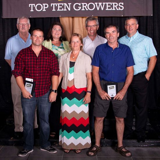 Front Row, L-R: Tobie Daigle, Carole Daigle, Fabien Daigle 
Back Row, L-R: Dale McCarthy, VP Integrated Supply Chain NA, Christine Wentworth, VP Agriculture NA, Allison McCain, Chairman, McCain Foods Limited, Luc Coté, Field Department Manager. 
