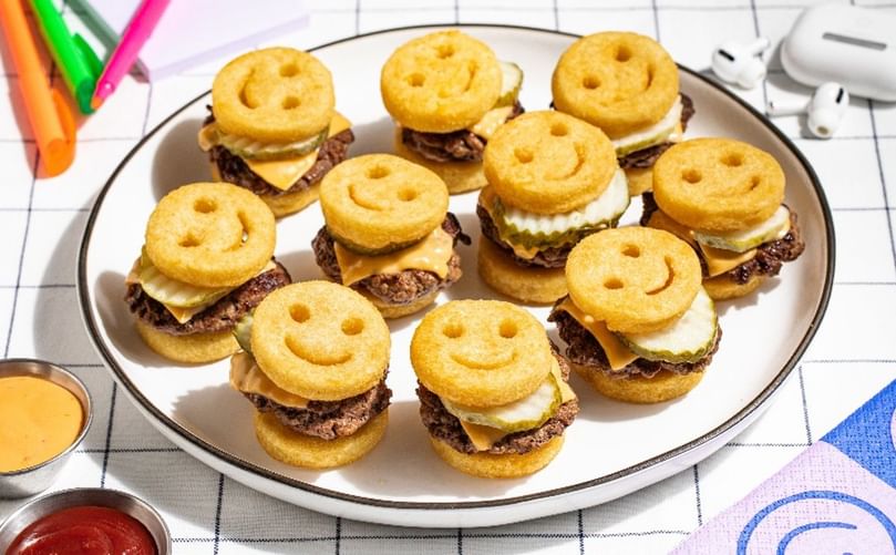 Bring joy to the table with McCain® Smiles—crispy potato fun turned into bite-sized sliders the whole family will love.