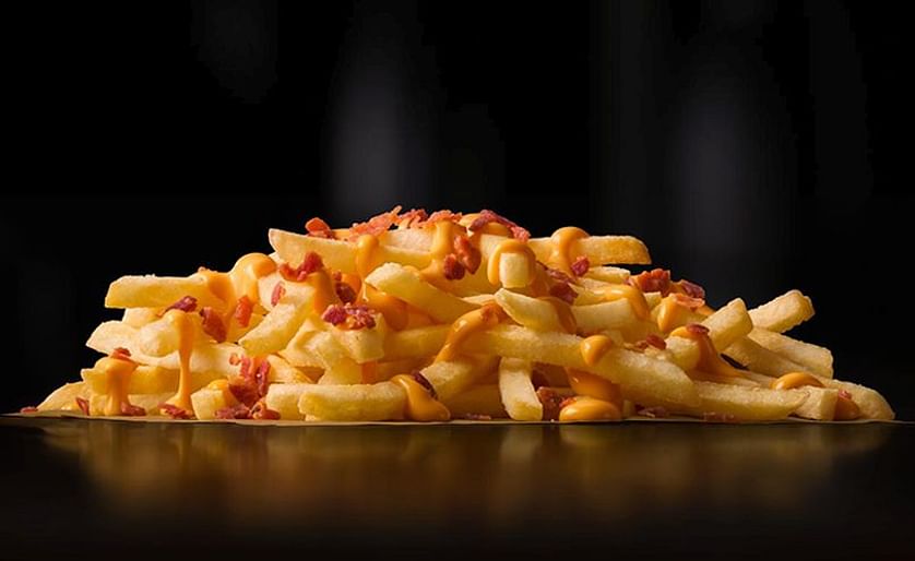 Cheese & Bacon Loaded Fries from Australia, McDonald's World Famous Fries, served with warm melted cheese and crispy bacon bits. Now in Chicago!