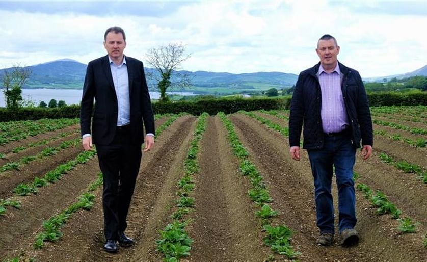 Minister for Agriculture, Food and the Marine Charlie McConalogue (left) on the farm of Co Donegal potato grower Charlie Doherty (right) on the banks of Lough Swilly.