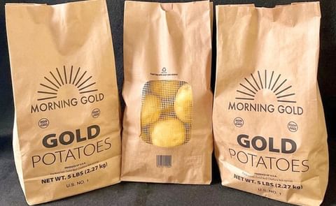 The new potato packaging bags are made of two-ply paper with compostable glue used around the window of the bag. The new potato packaging bags are made of two-ply paper with compostable glue used around the window of the bag.