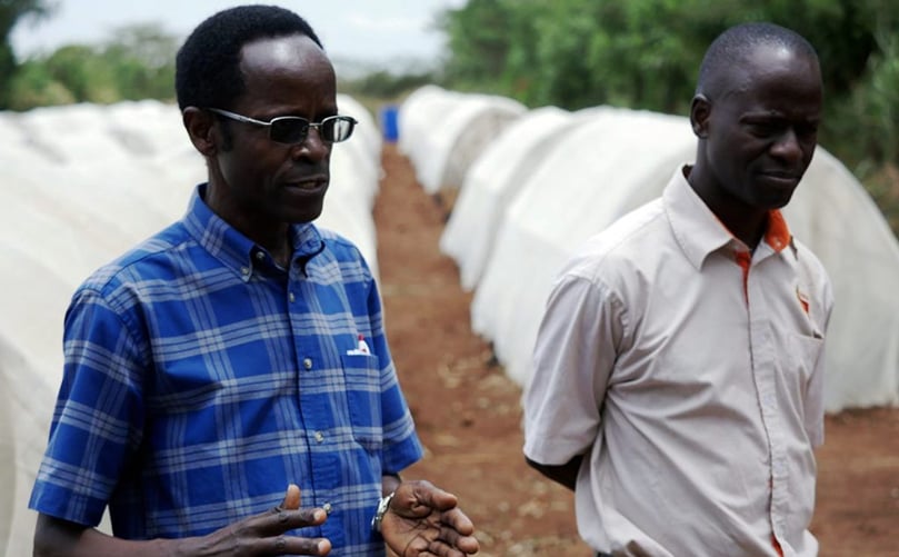 NC State graduate Robert Mwanga (left) on a research farm outside Kampala, Uganda. (Courtesy: NC State University) NC State graduate Robert Mwanga (left) on a research farm outside Kampala, Uganda. (Courtesy: NC State University)