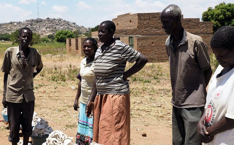 Along a highway in central Uganda, vendors sell slices of dried white-fleshed sweet potatoes. (Courtesy: NC State University) Along a highway in central Uganda, vendors sell slices of dried white-fleshed sweet potatoes. (Courtesy: NC State University)