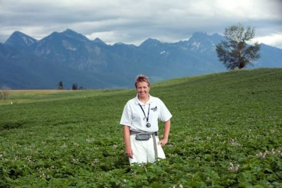 Nina Zidack, director of the MSU Potato Lab, says Montana's seed potato fields are located in some of the most beautiful spots in the state. She is shown here during a July 2011 inspection of a field near Ronan. (Photo by Susan Lake). Nina Zidack, director of the MSU Potato Lab, says Montana's seed potato fields are located in some of the most beautiful spots in the state. She is shown here during a July 2011 inspection of a field near Ronan. (Photo by Susan Lake).