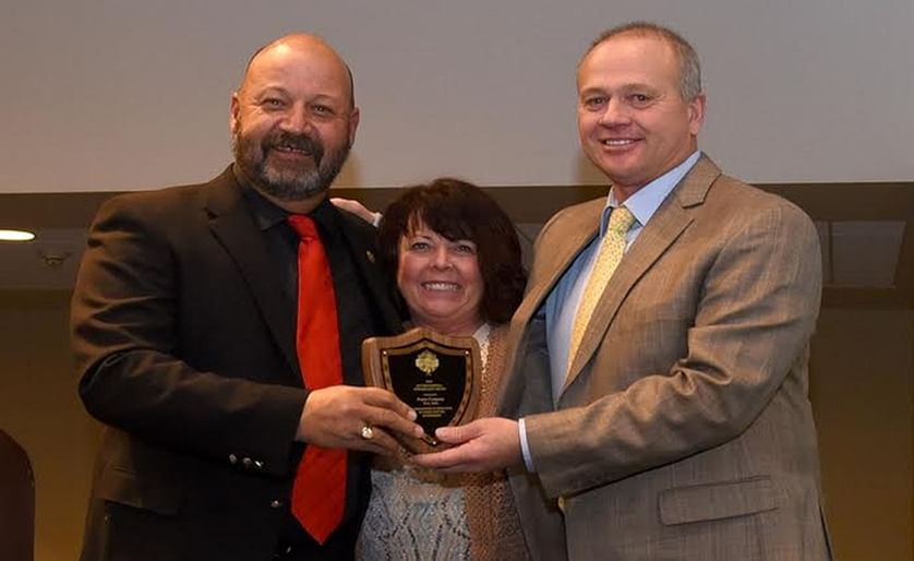 Boyd Foster (right) and his wife Laurie of Vista Valley Ag in Ririe, Idaho, receive the prestigious 2016 Environmental Stewardship Award from Jim Tiede (left)