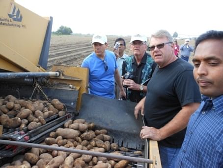 Tour participants observed a pause in the potato harvest at Amstad Farms in Hermiston, Ore. Todd Dimbat, a partner at the farm, explains how irrigation plays a critical role in potato production and that about 30 inches of applied water is necessary for a successful potato crop.