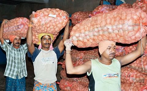 Workers carry potatoes inside a cold storage at Aiginia in Bhubaneswar, Odisha (Courtesy: Telegraph India / Ashwinee Pati) Workers carry potatoes inside a cold storage at Aiginia in Bhubaneswar, Odisha (Courtesy: Telegraph India / Ashwinee Pati)
