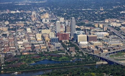 An aerial view of Omaha, Nebraska, with the Conagra Foods facilities clearly visible in the foreground around "Conagra Lake", right adjacent to the Missouri River. About 1,200 people will remain working on this riverfront campus after the restructuring is An aerial view of Omaha, Nebraska, with the Conagra Foods facilities clearly visible in the foreground around "Conagra Lake", right adjacent to the Missouri River. About 1,200 people will remain working on this riverfront campus after the restructuring is