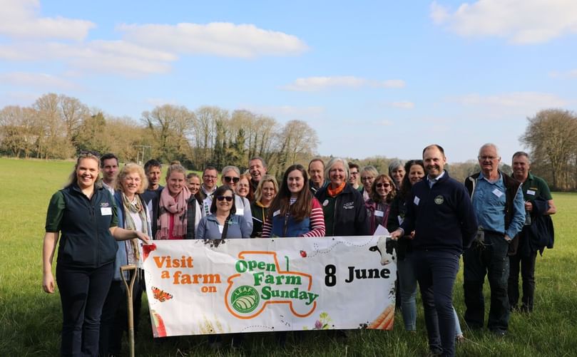 The team and volunteers behind Open Farm Sunday 2025 with the event banner, marking a record year of public engagement and meaningful connections with British farming.