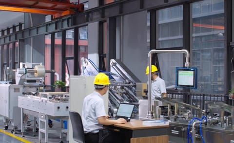A SINOBAKE operator oversees an automated snack production line, demonstrating intelligent control and customized manufacturing solutions for global food brands. A SINOBAKE operator oversees an automated snack production line, demonstrating intelligent control and customized manufacturing solutions for global food brands.