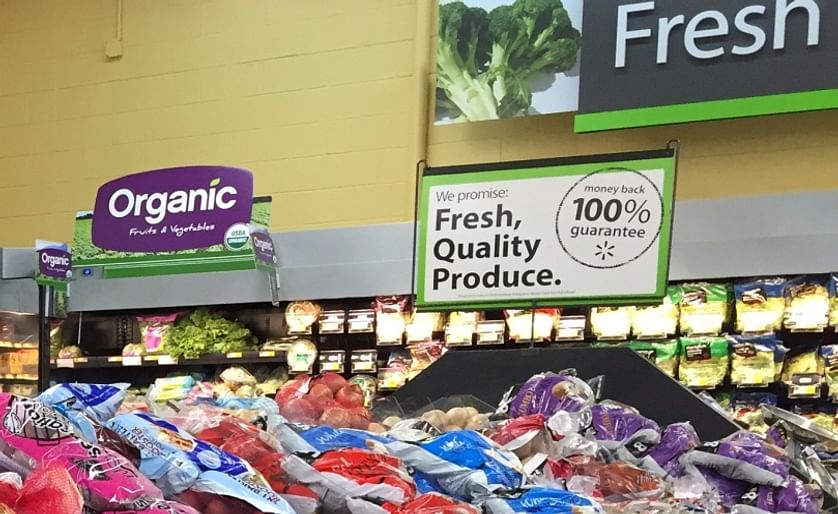 Sign promoting certified USDA Organic Fruits and Vegetables in a Walmart Produce department