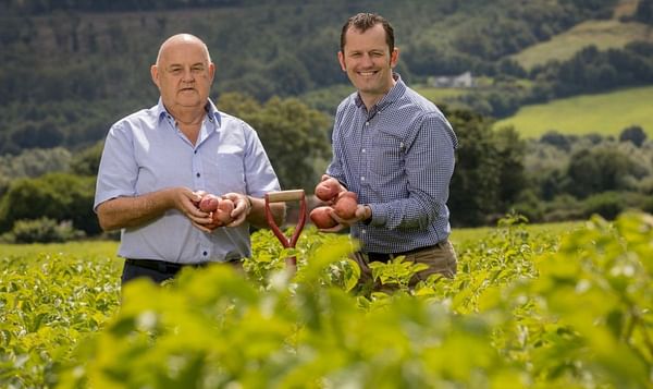 John O'Shea of O'Shea's farms and Paul Scally, Aldi Ireland's Buying Director in a potato field