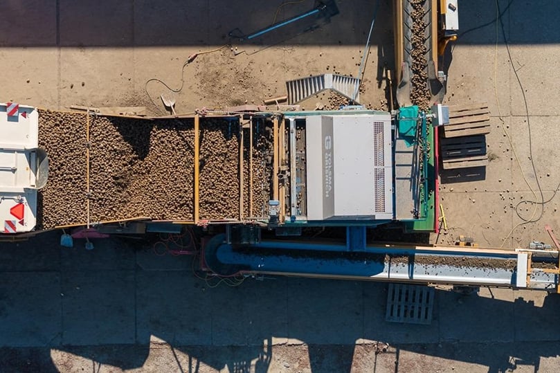 Sorting unwanted materials before storage helps growers reserve more storage space for marketable crops.