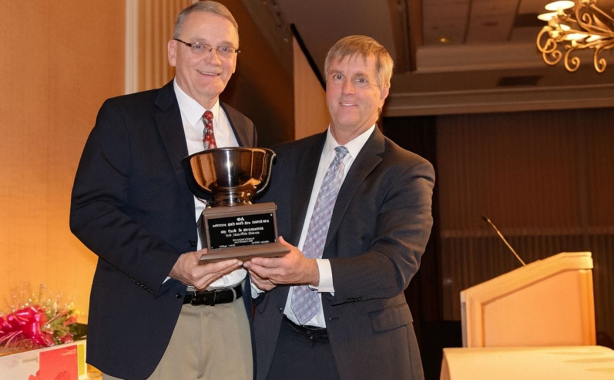 Neil Gudmestad (left), a potato pathologist with North Dakota State University, is The Packer's 2015 Potato Man for All Seasons. The award was announced Jan. 14 by The Packer's National Editor Tom Karst (right) at the National Potato Council meeting in La