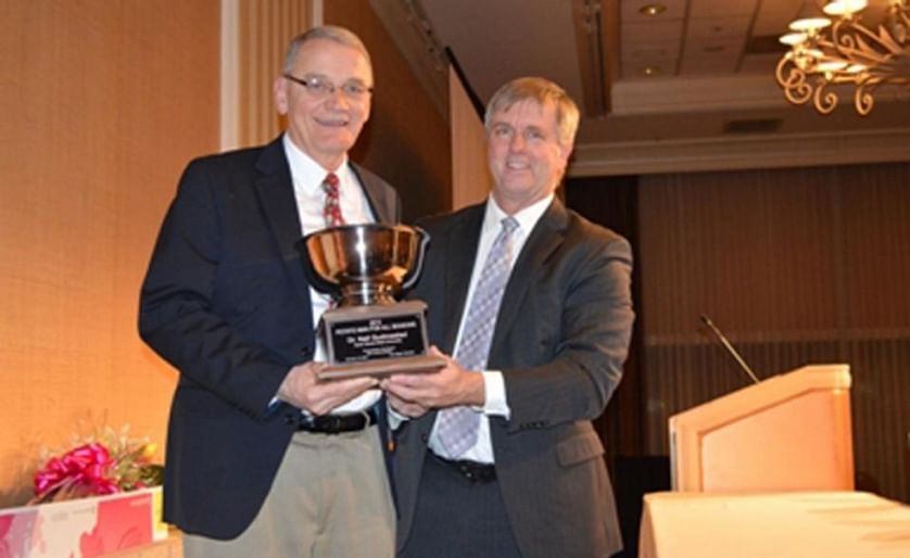 Neil Gudmestad (left), a potato pathologist with North Dakota State University, is The Packer's 2015 Potato Man for All Seasons. The award was announced Jan. 14 by The Packer's National Editor Tom Karst (right) at the National Potato Council meeting in La