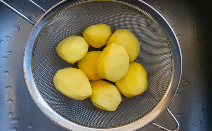 Freshly Peeled Potatoes Prepared for Processing Freshly Peeled Potatoes Prepared for Processing