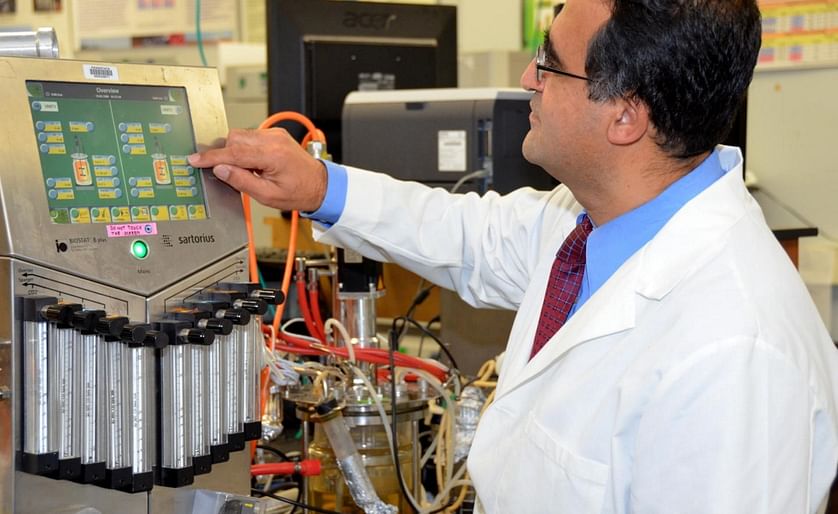 Penn State Researcher Ali Demirci adjusts a bioreactor in which potato waste is being used to produce bioethanol with a novel process that simultaneously employs mold and yeast to convert starch to sugar and sugar to ethanol.