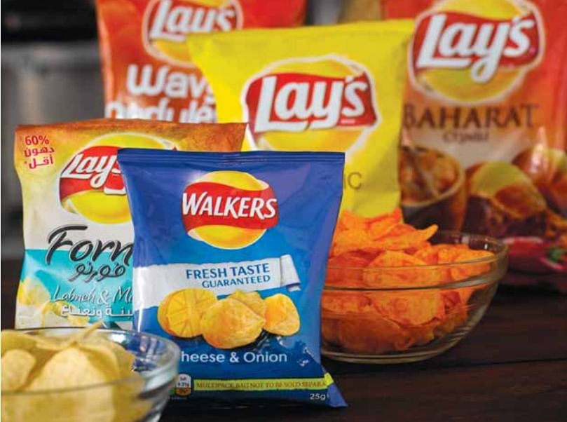 Pepsico's global potato chip portfolio offers flavors that appeal to local taste profiles and culinary trends. Many of Pepsico's snacks, such as the Walkers Cheese & Onion crisps pictured below, already have reduced saturated fat levels, progress the company will work to build on over the next decade