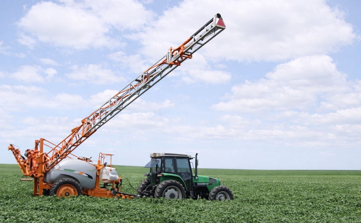 Spraying pesticides in potato field Spraying pesticides in potato field