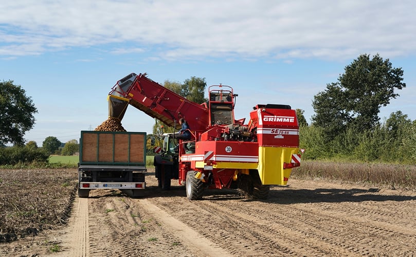 Self-Propelled Potato Harvester Unloading into Trailer Self-Propelled Potato Harvester Unloading into Trailer