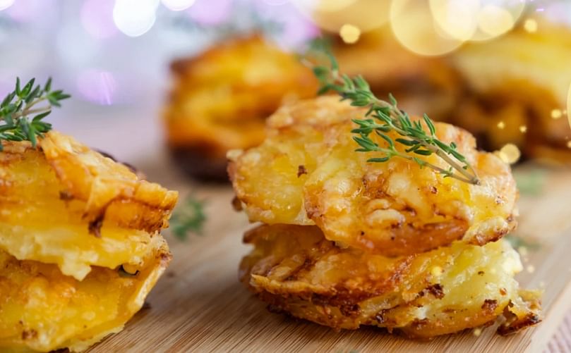 Potato Gratin Stacks: Perfect party food, or a deliciously indulgent side, these creamy, cheesy stacks are baked individually for a special touch. For best results use a good non-stick muffin tin and be sure to slice the potatoes as thinly as you can for quick and even cooking.