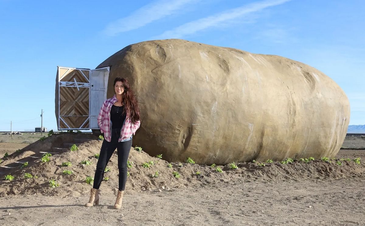 Kristie Wolfe poses with her Big Idaho Potato Hotel, a miniature home located in Boise that she built from the original 6-ton replica potato mounted on the Idaho Potato Commission’s Great Big Idaho Potato Truck. (Courtesy: Kristie Wolfe)