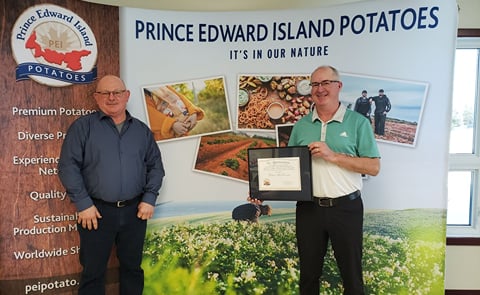 PEI Potato Board Chairman Wayne Townshend (left) presents Potato Industry Recognition Award to Peter McKenna (right) PEI Potato Board Chairman Wayne Townshend (left) presents Potato Industry Recognition Award to Peter McKenna (right)