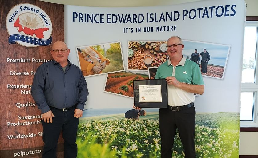PEI Potato Board Chairman Wayne Townshend (left) presents Potato Industry Recognition Award to Peter McKenna (right)