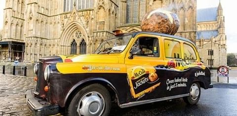 McCain Potato scented taxi in front of london eye