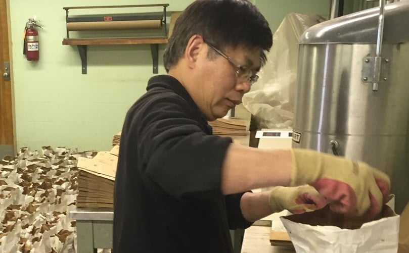 Xinshun Qu, associate research professor, leads Penn State’s potato research program. Here, he organizes seed potatoes for varietal testing. The bags are taken to research trials at multiple locations across Pennsylvania, where the seed will be planted for evaluation. (Courtesy: Robert Leiby) Qu prepping seed