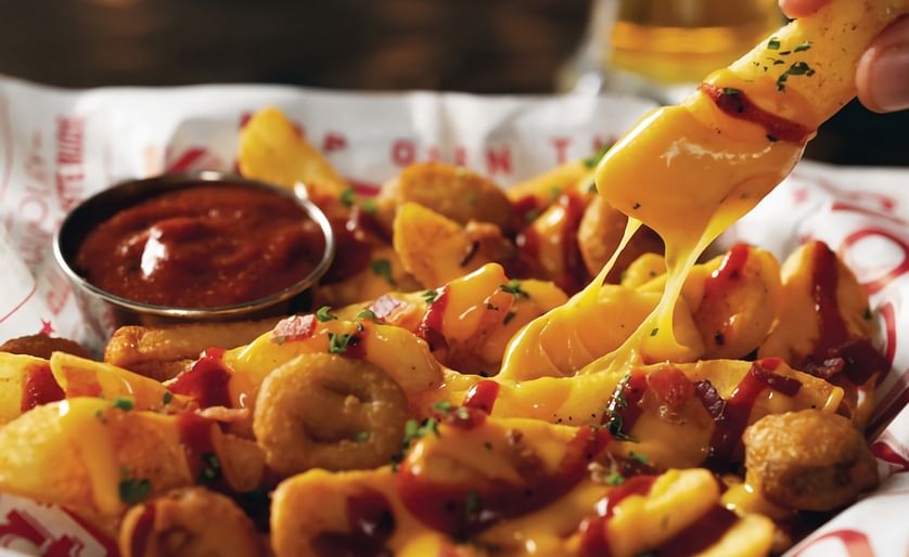 Available at Red Robin Gourmet Burgers and Brews restaurants for a limited time, Voodoo Fries features Red Robin's signature steak fries tossed in blackened seasoning, smothered in queso, topped with bacon, and fried jalapenos and drizzled with fiery ghos