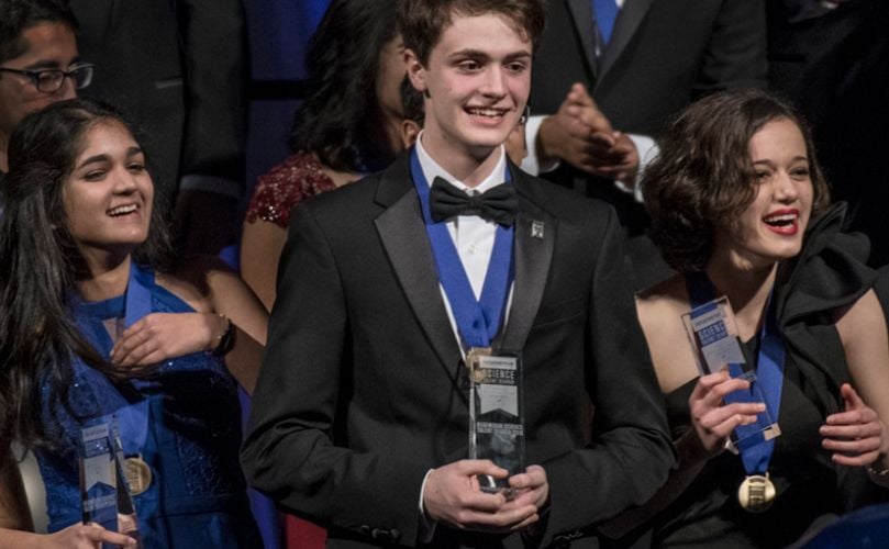 First-place winner Benjamin Firester (center), 18, took home a $250,000 prize. Natalia Orlovsky (right), 18, picked up $175,000 for second place, and Isani Singh (left), 18, received the third-place prize of $150,000 (-->Top ten winners)
(Courtesy: Society for Science & the Public / Chris Ayers) First-place winner Benjamin Firester (center), 18, took home a $250,000 prize. Natalia Orlovsky (right), 18, picked up $175,000 for second place, and Isani Singh (left), 18, received the third-place prize of $150,000 (-->Top ten winners)
(Courtesy: Society for Science & the Public / Chris Ayers)